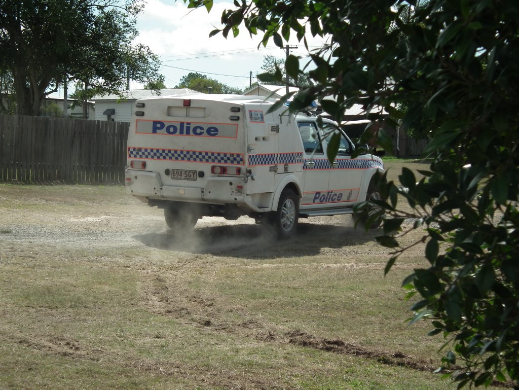 A man was shouting unintelligibly from the back of a police wagon after he was apprehended. A man was shouting unintelligibly from the back of a police wagon after he was apprehended.